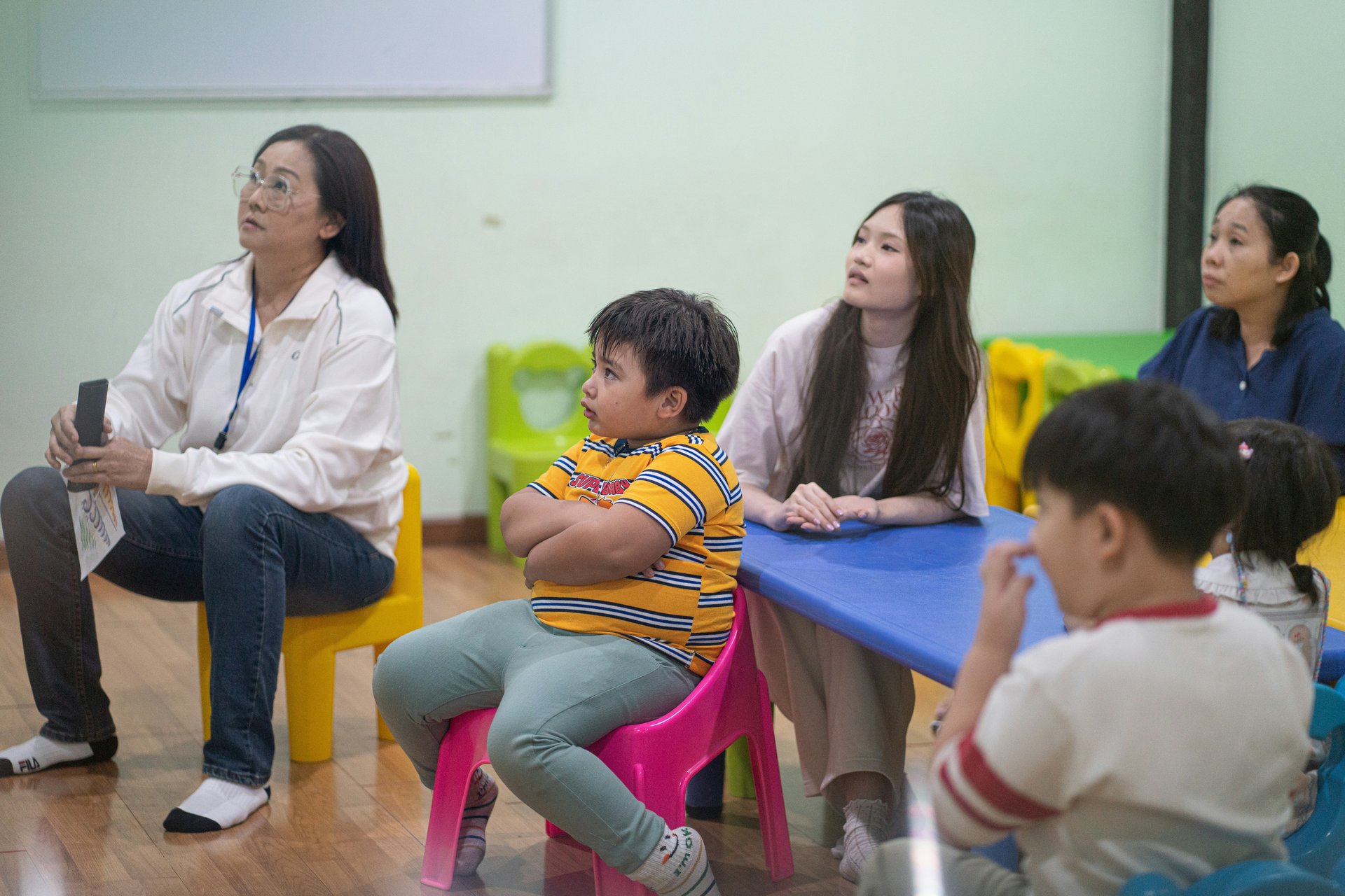 Children sitting in a classroom setting