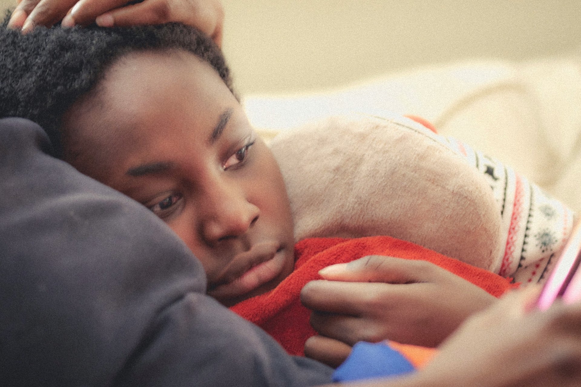 A child being comforted by an adult