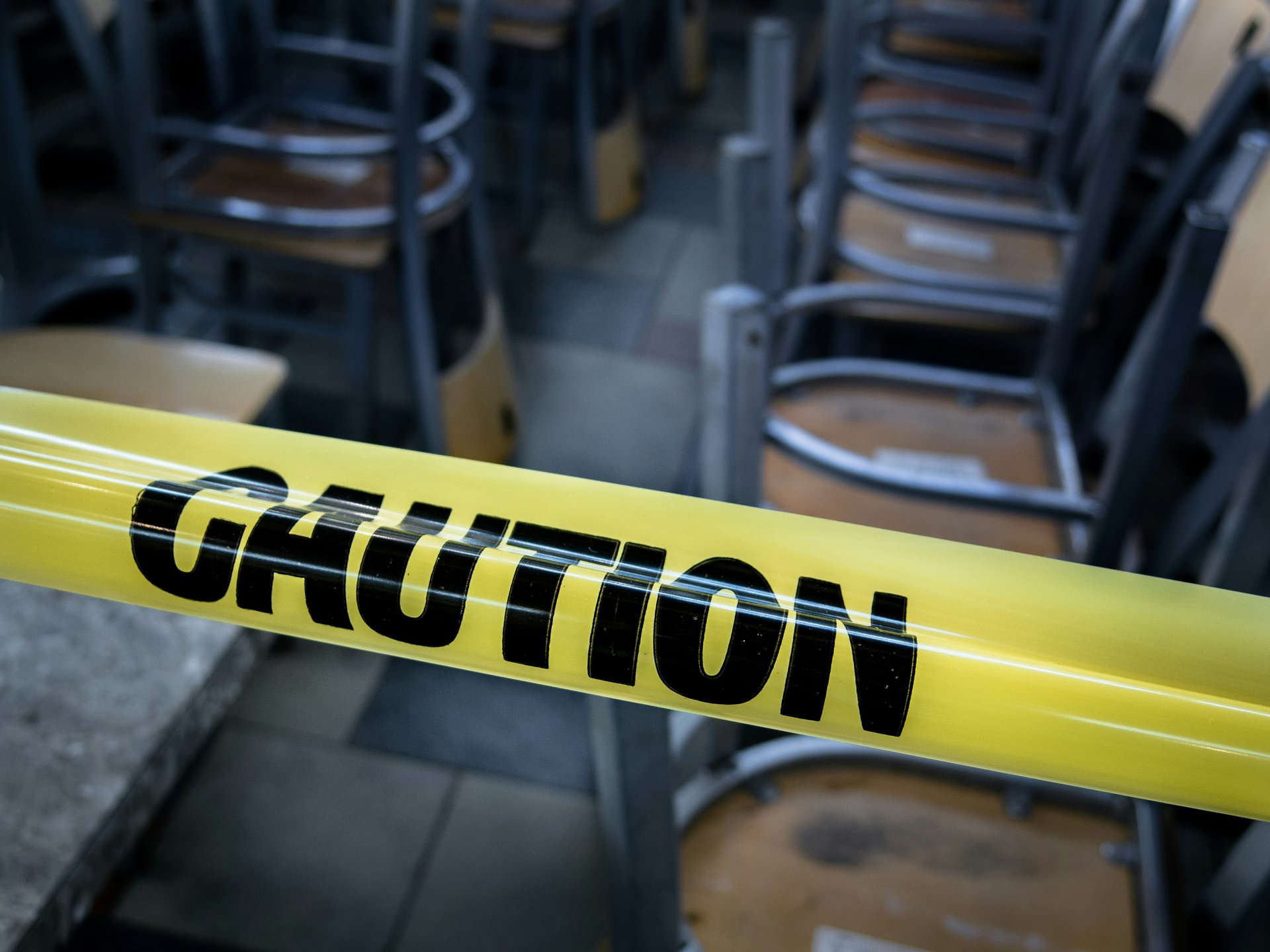 Caution sign by an empty classroom