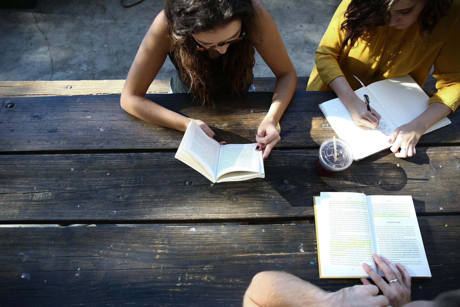Teen students studying together at a table in school