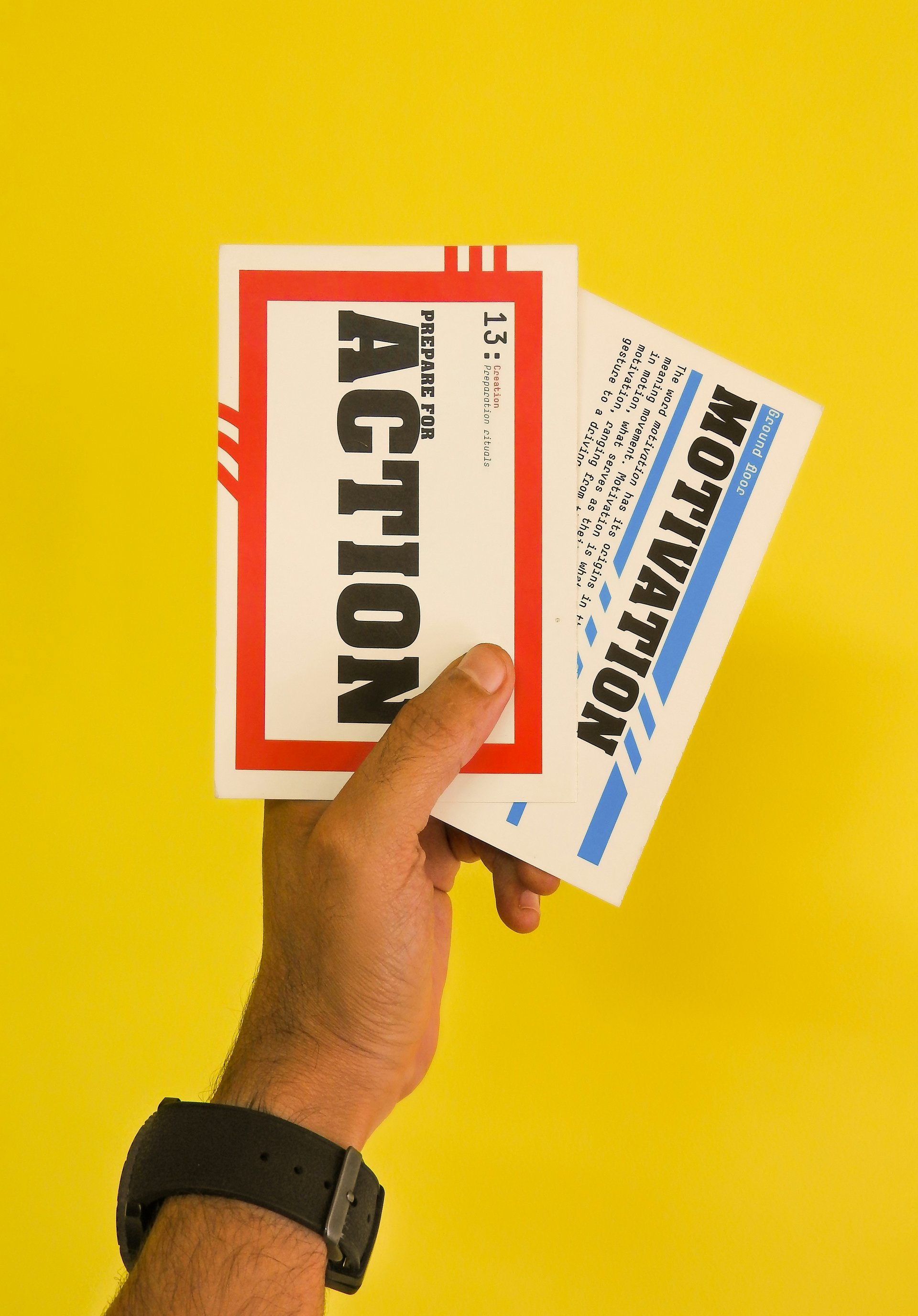 Person holding flyers at a community event