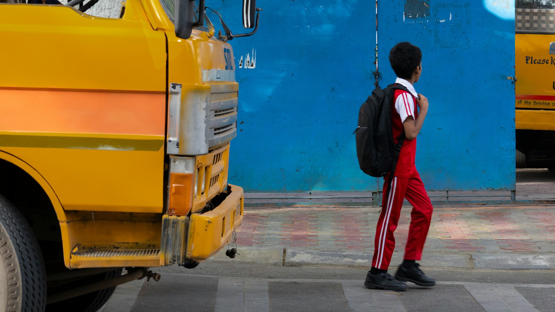 Students near a yellow school bus
