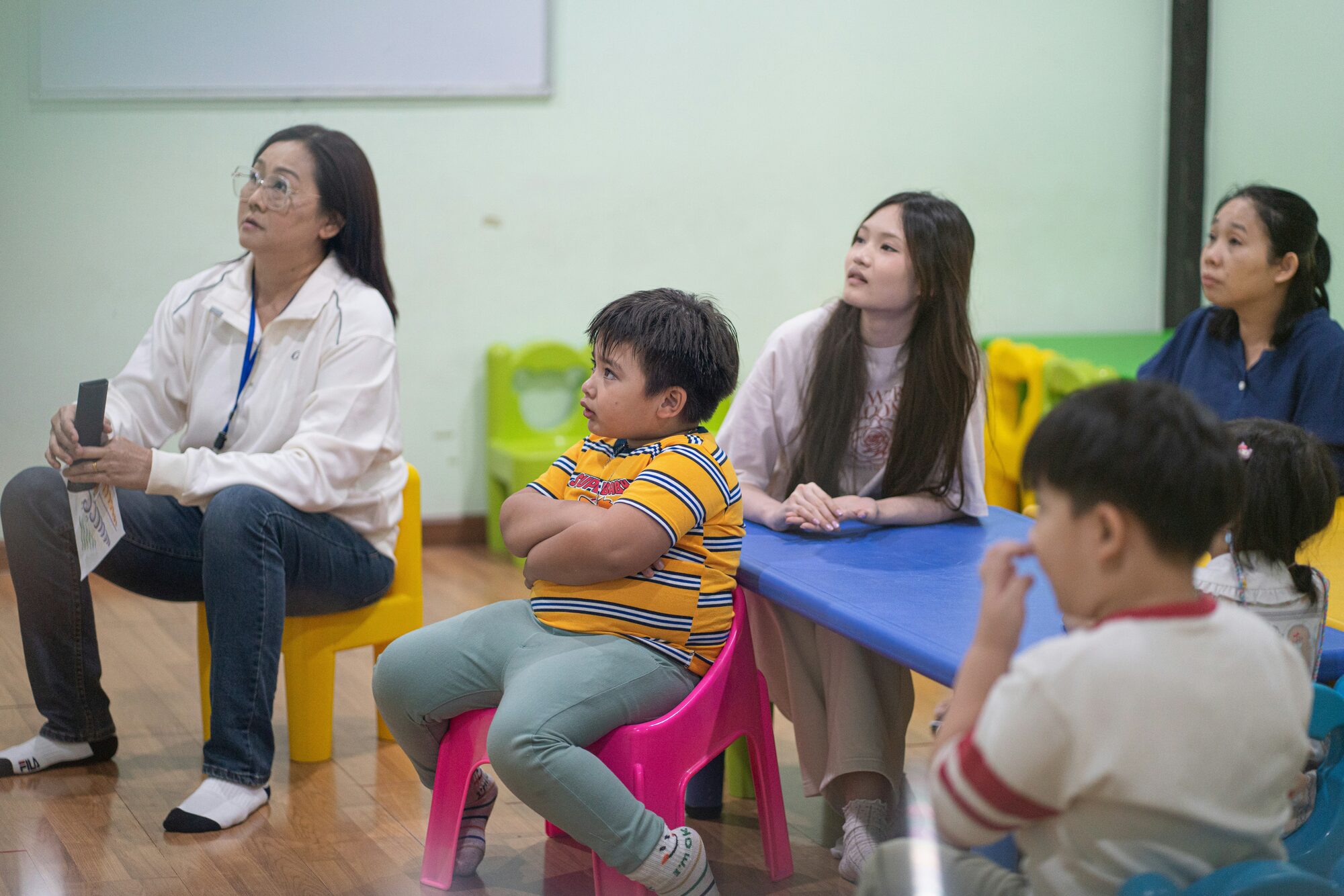 Parent and teacher meeting in a school setting