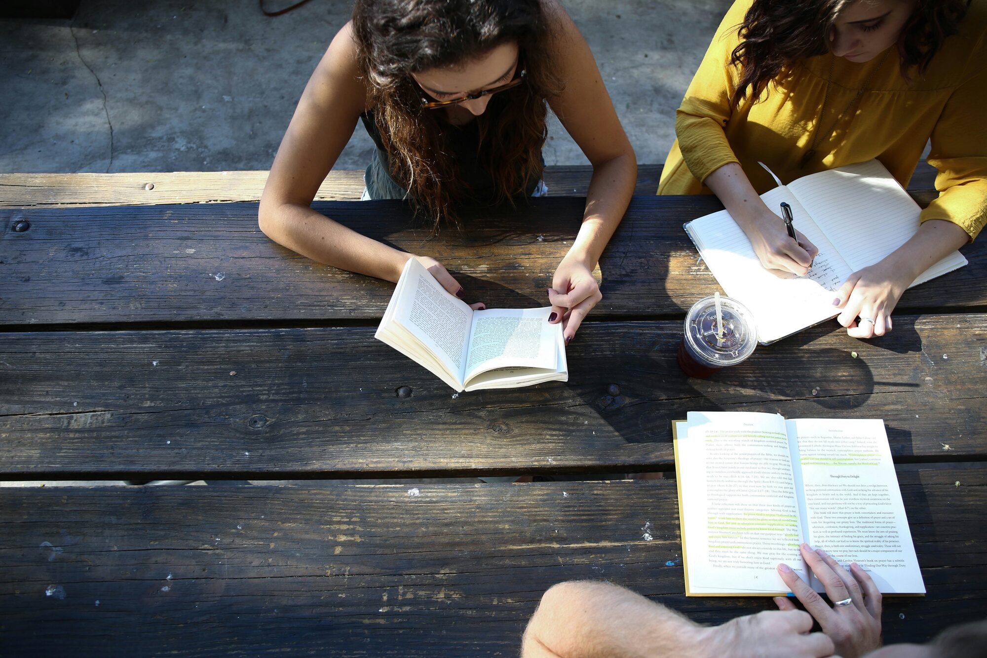 Teen students studying together at a table in school
