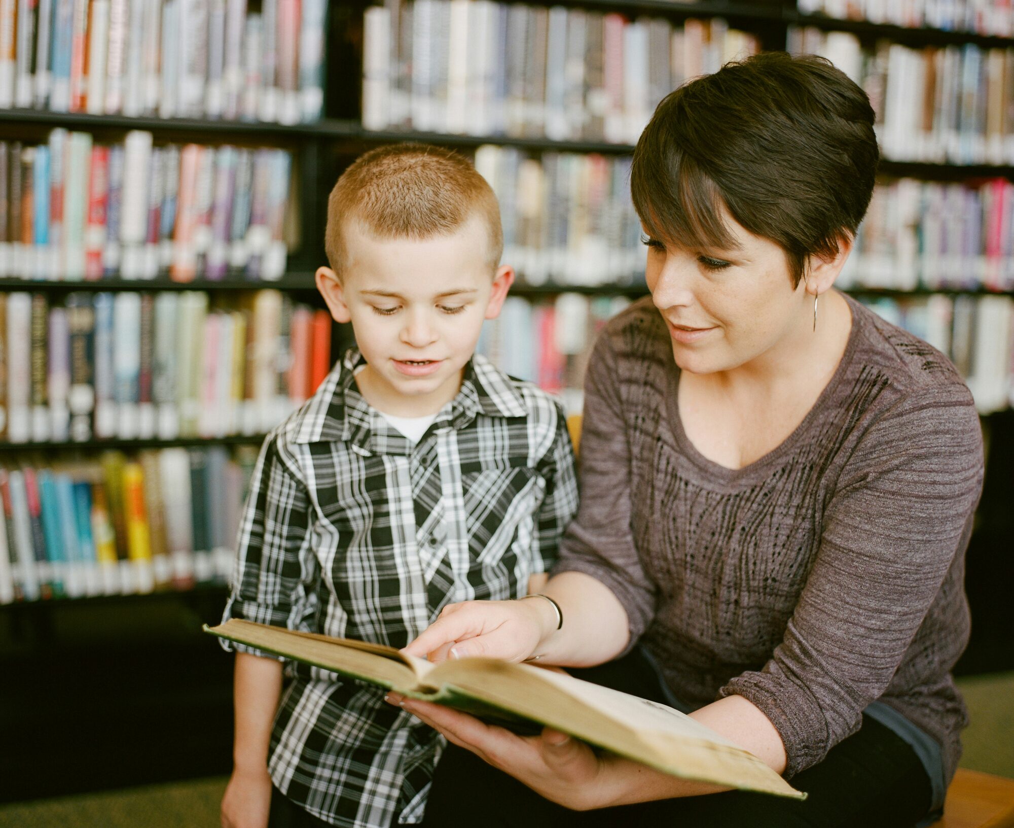 Teacher helping a student in a classroom
