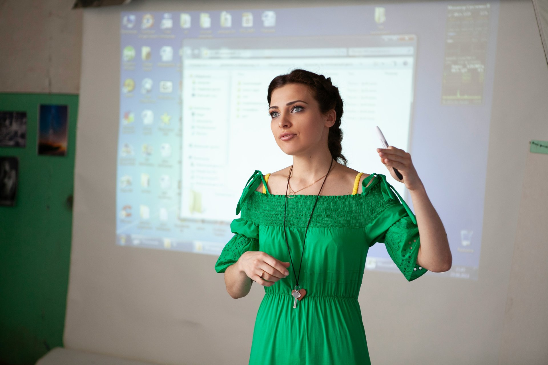 Teacher at front of classroom giving a lesson