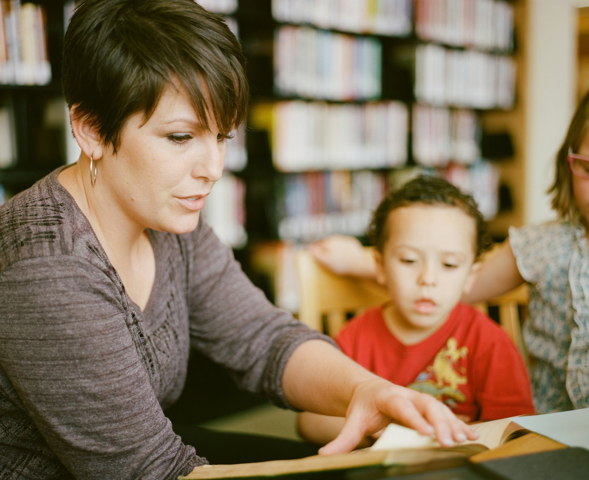 Teacher reading to a group of students