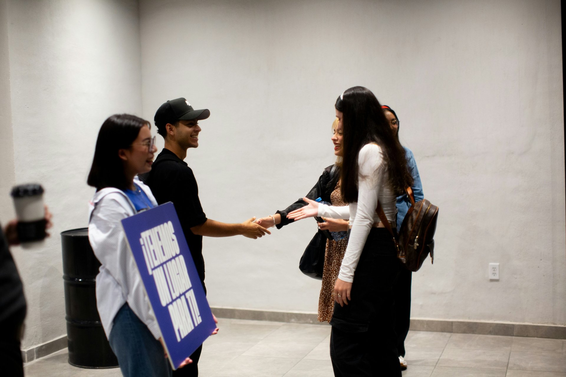 Students welcoming new members to a group